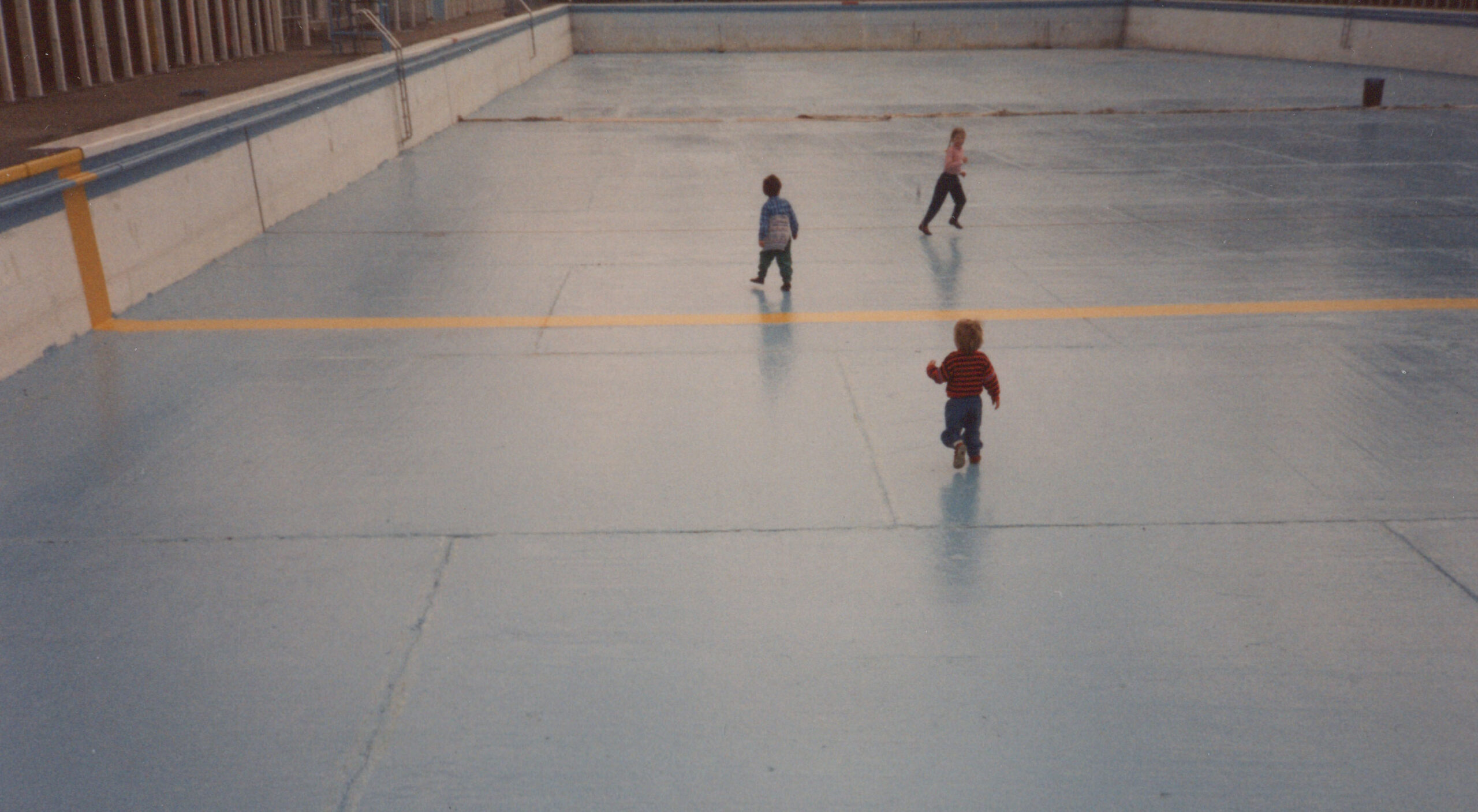 Children Playing in Empty Pool